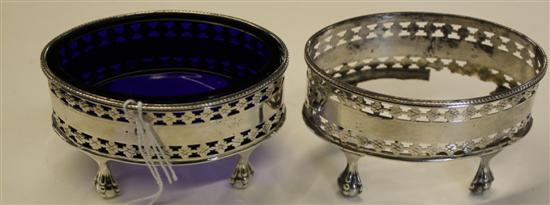 Pair of George III oval pierced silver salts (damage & 1 blue glass liner)